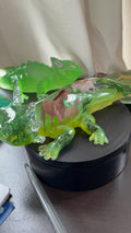 Green resin axolotl figurine with wild horse design and moss accents