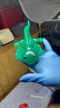 Thermochromic resin axolotl changing from teal blue to lime green