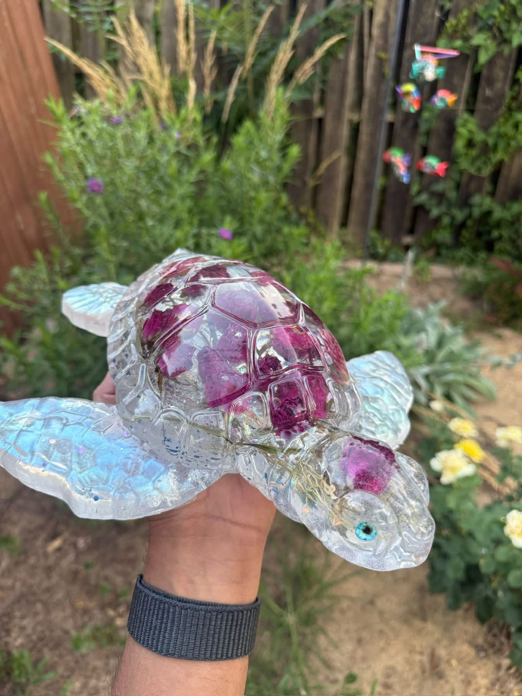 Giant clear resin turtle with preserved roses and LED light base