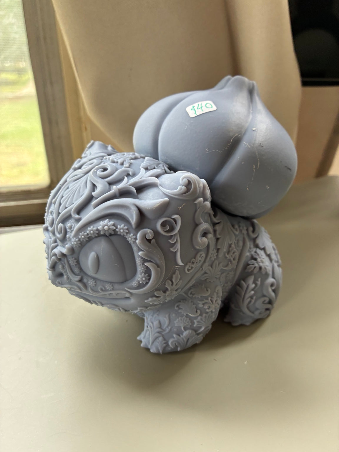 Large ornate Bulbasaur-inspired UV resin 3D printed DIY paint figure, front side angle