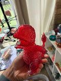 Red translucent hollow Charmander-inspired UV resin 3D printed figure, side view