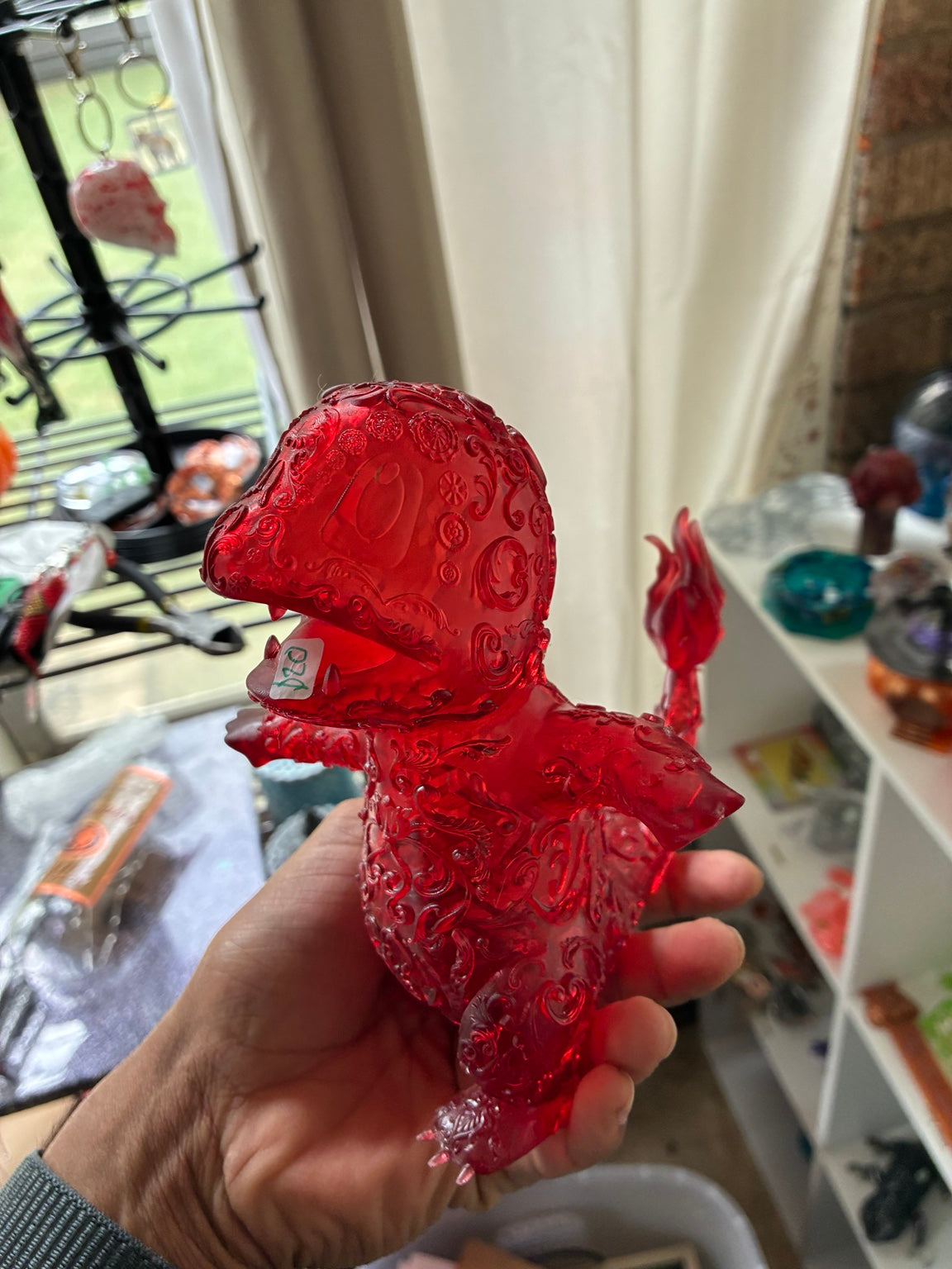 Red translucent hollow Charmander-inspired UV resin 3D printed figure, side view