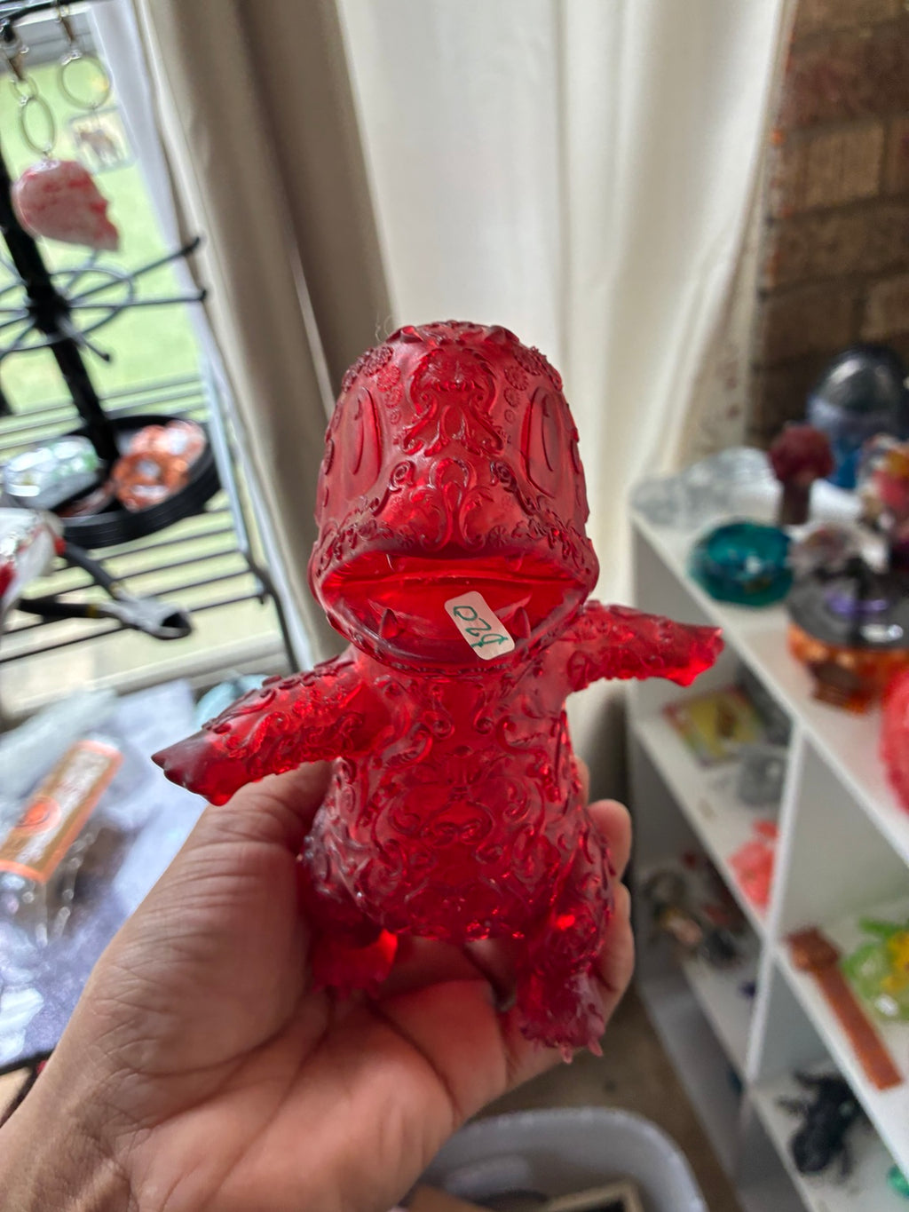 Red translucent hollow Charmander-inspired UV resin 3D printed figure, front view