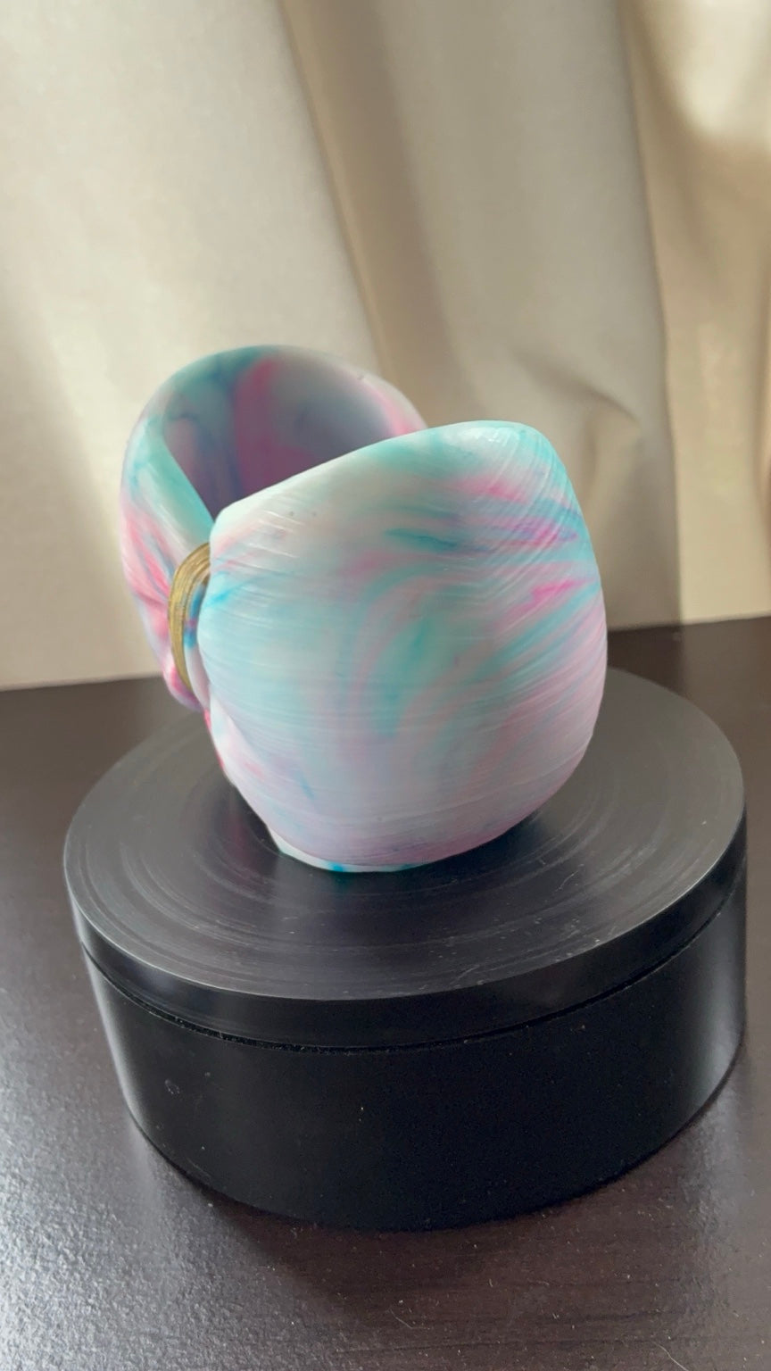 Side view of cotton candy tie-dye resin bow holder