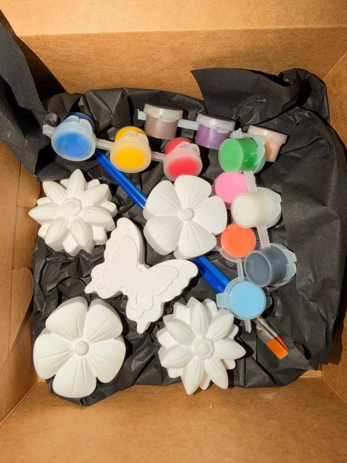 Flower and butterfly paint kit with unpainted ceramic resin shapes, colorful paints and brushes