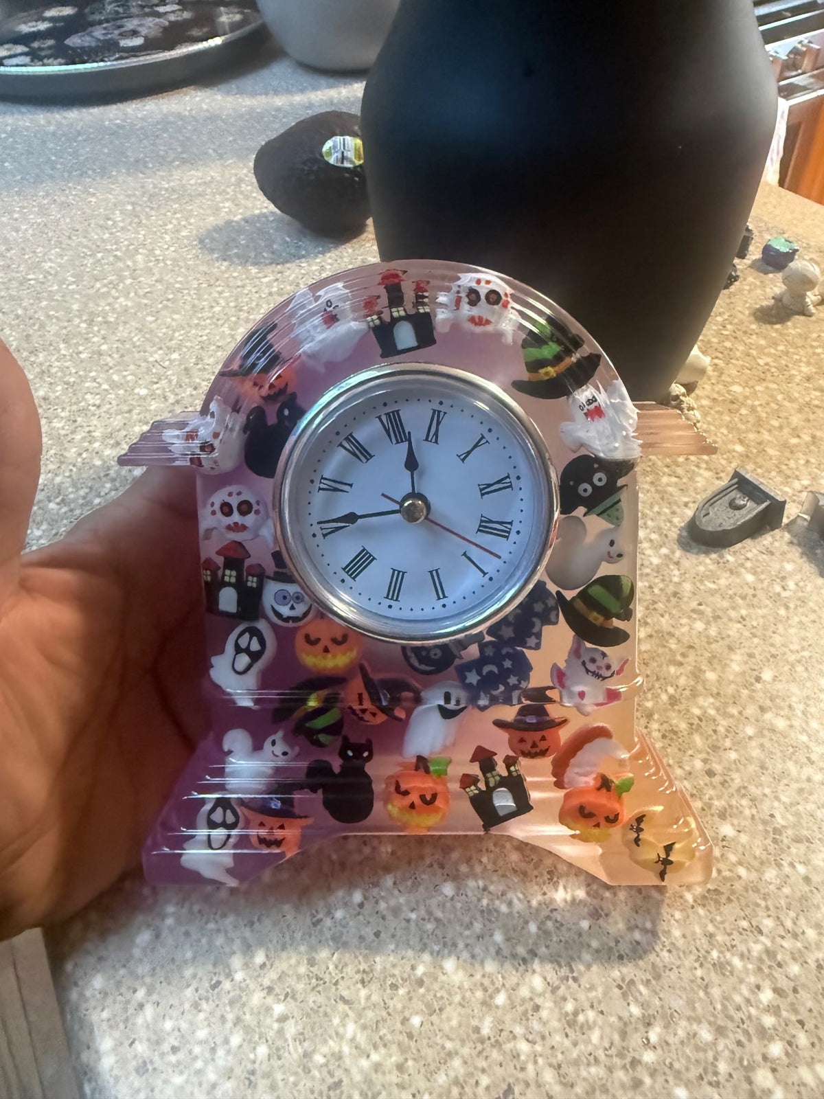 Close-up of Halloween epoxy resin clock and embedded charms