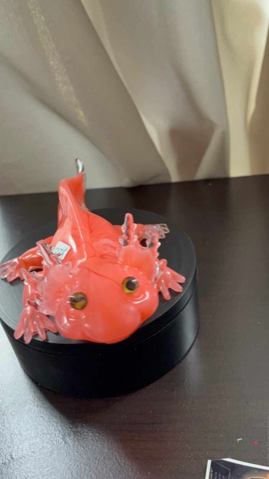 Angled front view of handmade pink resin axolotl figurine