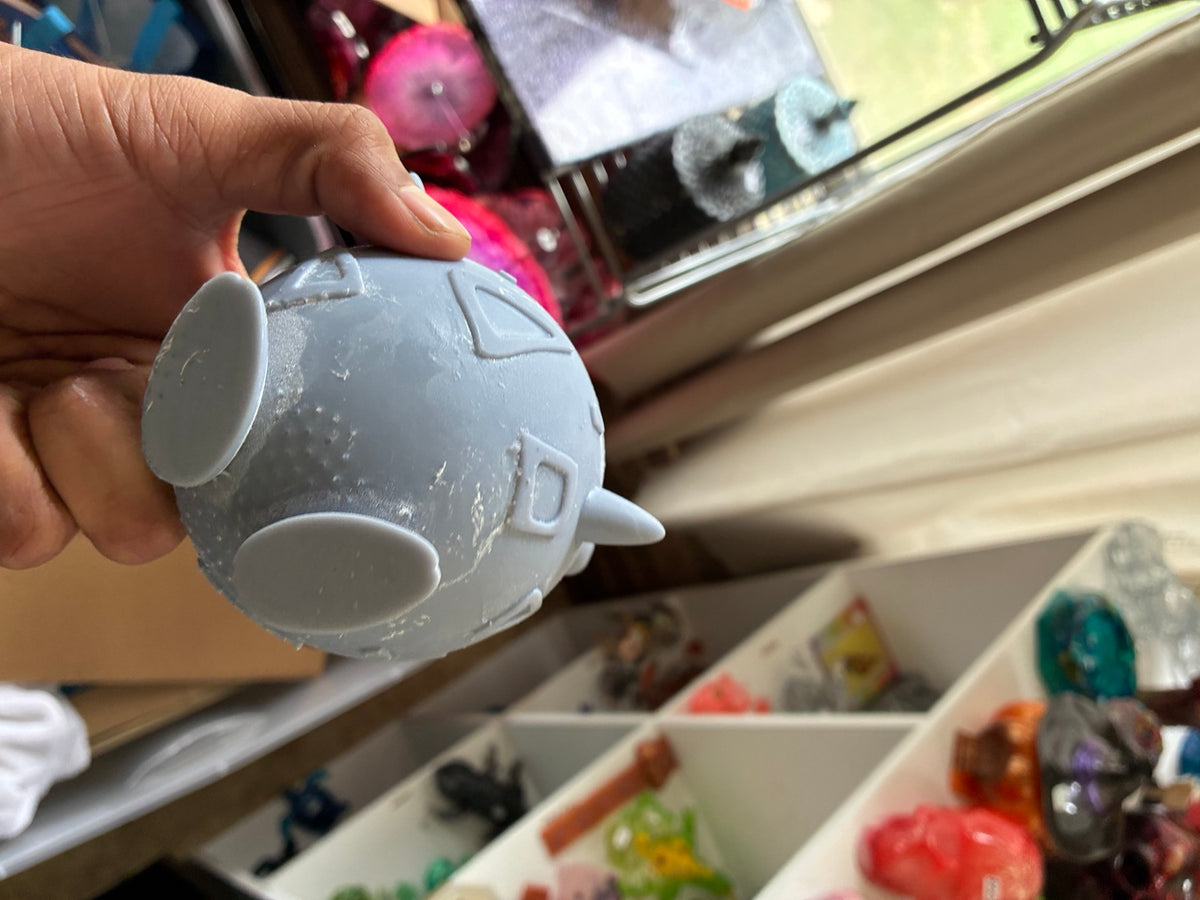 Gray solid Togepi-inspired UV resin 3D printed DIY paint figure, bottom and side view
