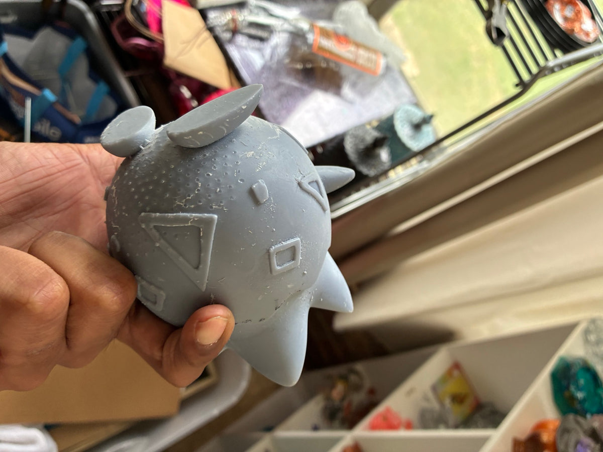 Gray solid Togepi-inspired UV resin 3D printed DIY paint figure, rear side view showing print surface