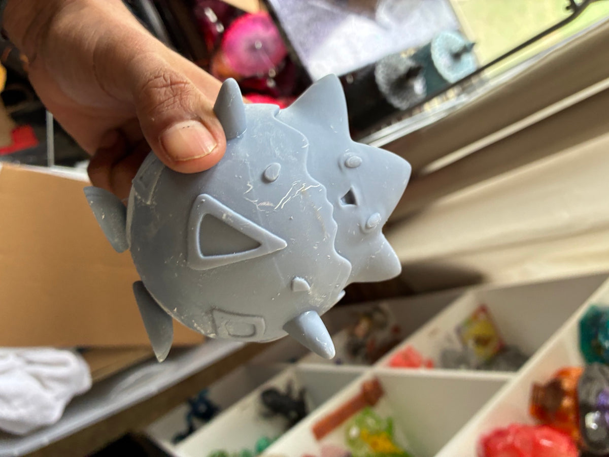 Gray solid Togepi-inspired UV resin 3D printed DIY paint figure, alternate side view